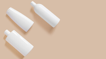 Set of white cosmetic bottles and creams on a beige background.