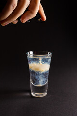 alcohol coloured cocktails with lights