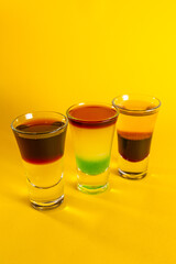 alcohol coloured cocktails with lights