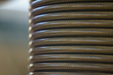 Durable electrical cable with stainless sheath wound on a spool