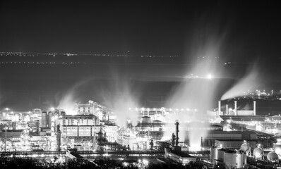 large smoke factory at night with long exposure