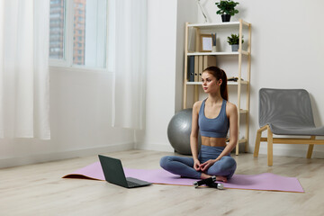 woman health laptop training video mat lifestyle home fit lotus yoga