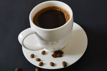 Morning tradition. Atmospheric coffee break. Top view of the white cup of coffee.