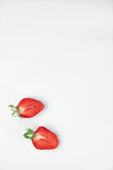 delicious fragrant pancakes folded in a triangle on a white plate and a blue background and decorated with delicious ripe sweet strawberries, red fragrant cherries and coconut flakes