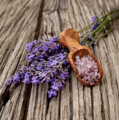 Fototapeta na wymiar Lavender flowers on wooden background with lavander salt