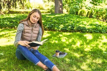 Lost in a world of words, a woman finds serenity in parkside reading.