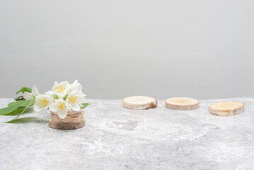 Fototapeta na wymiar Jasmine on a marble table, light background