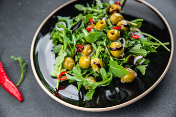 olive salad hot chili pepper, green mix lettuce, arugula meal food snack on the table copy space food background rustic top view