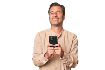 A middle-aged man using his phone