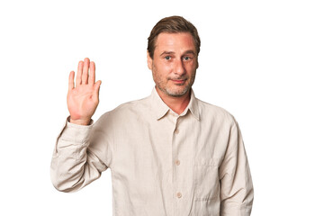 Fototapeta premium A middle-aged man isolated smiling cheerful showing number five with fingers.