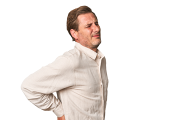 A middle-aged man isolated suffering a back pain.