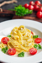 pasta tomato tagliatelle and parmesan cheese meal food snack on the table copy space food background rustic top view