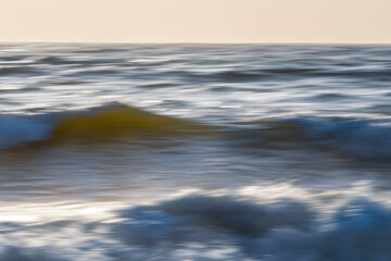 Dramatic seascape abstract. Sea waves in motion blur, and clear sky in the background, fine art. Pacific Ocean, California