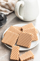 Sweet chocolate wafer on plate.