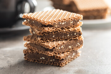 Sweet chocolate wafer on kitchen table.