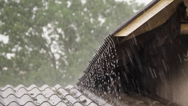 Heavy rain. Heavy rain falls on the old roof