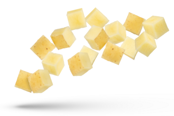 Flying vegetables. Flying potato cubes isolated on white background. Diced fresh potato isolate.