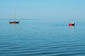 yachts on the water against the blue sky