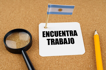 On the table is the flag of Argentina, a pencil and a sheet of paper with the inscription - find job