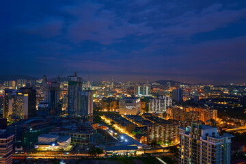 A nighttime cityscape. Night time illumination of a big city panorama. Top view from the drone