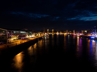 Rouen, France June 17, 2023. River Seine at night illuminated during the Rouen Armada Parade - Gustave Flaubert Bridge view at night