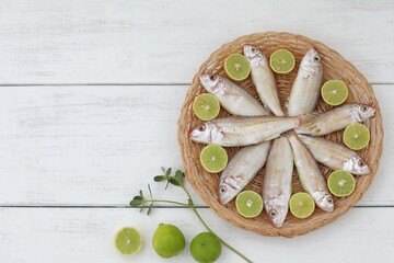 Red mullet, fish on kitchen table, top view, limes, place for text, background image, Mullus...