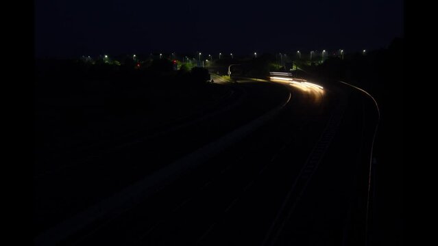 zooming night traffic on the motorway long tail lights
