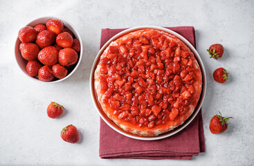 Cheesecake with strawberry sauce in a plate