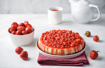 Cheesecake with strawberry sauce in a plate