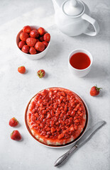 Cheesecake with strawberry sauce in a plate