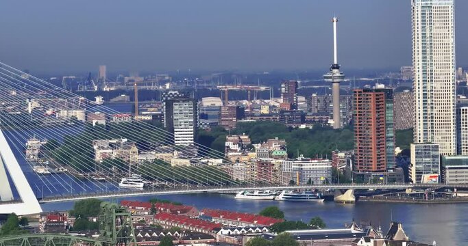Drone video over the Meuse and Rotterdam city center in the morning at sunrise