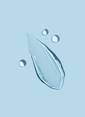Cosmetic smear of gel on a blue background. Skin care.