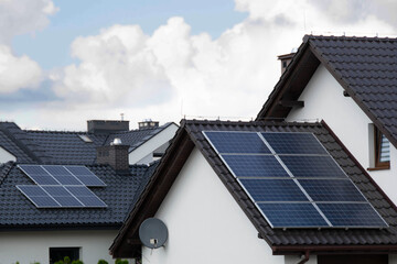 Naklejka premium Installing a Solar Cell on a Roof.