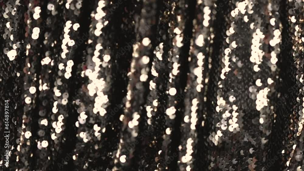 Wall mural abstract beautiful festive shiny background with golden sparkles and bokeh. fabric with sequins