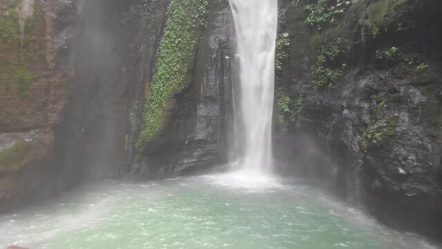 Aerial footage captured on DJI drone showing one of the largest waterfalls in Bali, Indonesia. Situated far north beyond Mount Batu one of the most isolated and densely vegetated areas on the island.