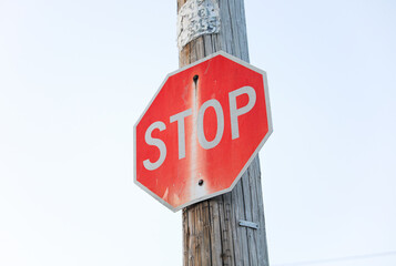 Vibrant red stop sign stands as a universal symbol of caution, commanding attention and urging a...