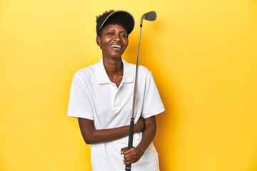African golfer woman with her golf club, sports concept, laughing and having fun.