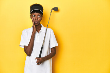 African golfer woman with her golf club, sports concept, is saying a secret hot braking news and looking aside