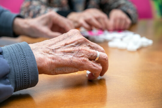 Close up of a senior group playing bingo at Nursing home. leisure game, support, assisted living, and retirement. High quality photo