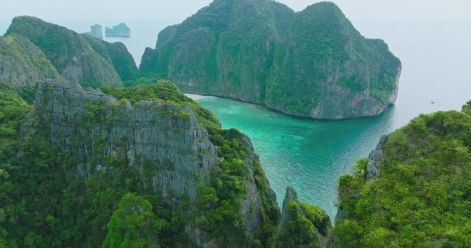 Aerial view of Phi Phi islands Travel Landmark of Krabi Phuket, Thailand. Amazing Drone footage over Maya beach with beautiful blue turquoise seawater. Tourist attraction in summer holidays.