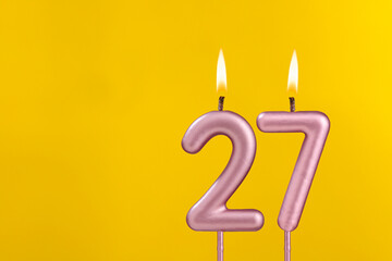 Candle 27 with flame - Birthday card on yellow luxury background