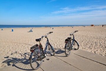 Bicycles on the beach in the Netherlands - 614911465