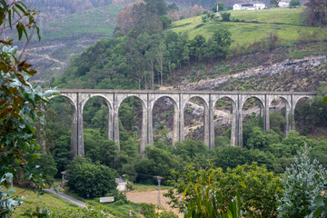 Fototapeta na wymiar Railway bridge over the Esva river in Asturias, Spain