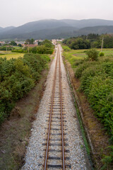 Obraz premium Railway, Railroad, Train Tracks, Green Pasture, Mountain on Background