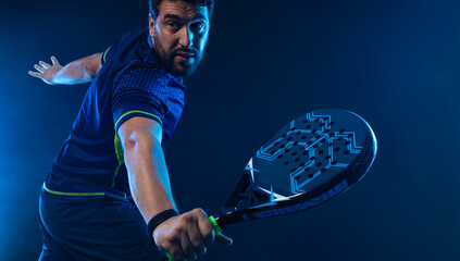 Padel Tennis Player with Racket in Hand. Paddle tenis, on a blue background. Download in high resolution. - 614916025
