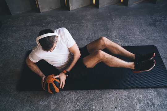 Sportsman doing abs exercises with ball