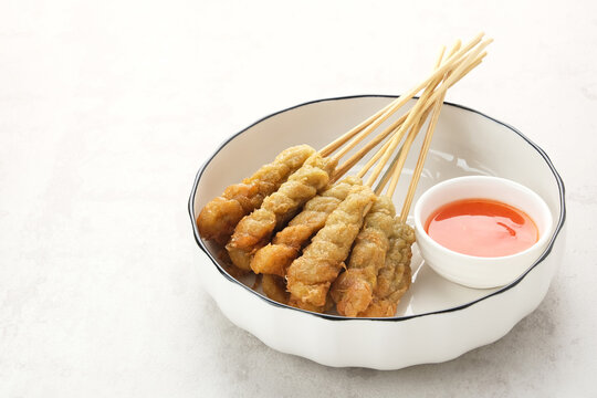 Sempol Ayam, made from minced chicken, spices and eggs. Served with chili sauce. Indonesian traditional food
