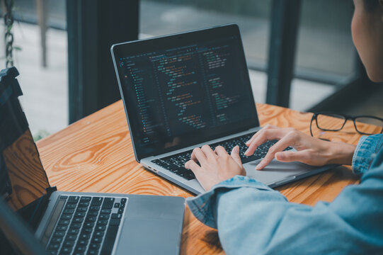 Female programmer working on coding, software development and web design.Concept technology development.