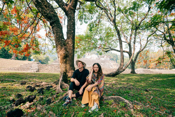 couple in Mayan ruins in Palenque, Chiapas, Mexico.