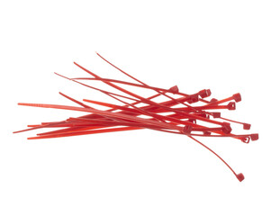 Plastic Cable tie in red to hold cable together or wrap around things for electrician, maintenance, repair man. Close up Plastic Cable tie small size, white background isolated